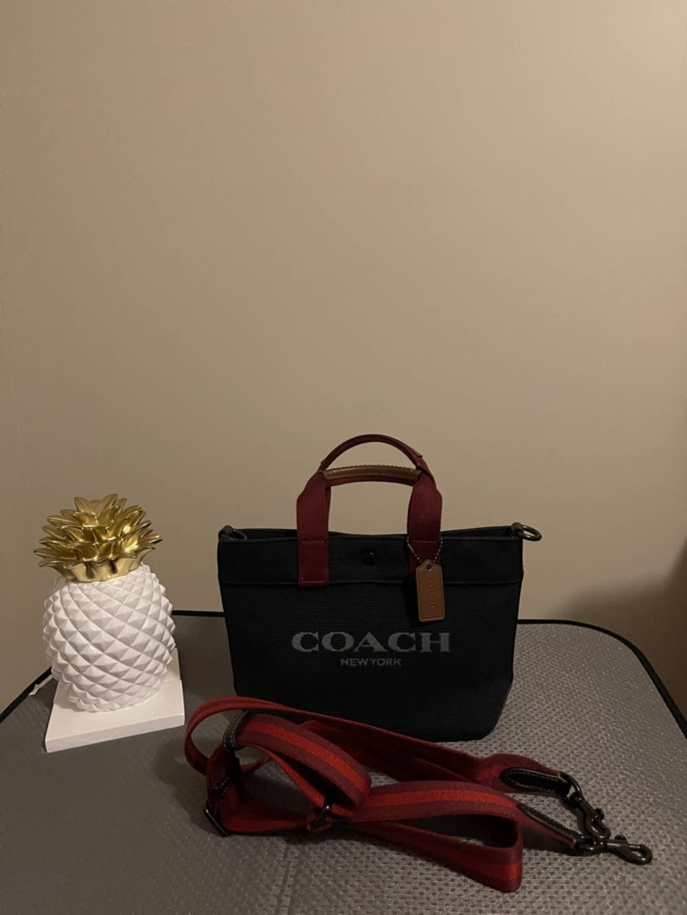 Unisex Coach Black Canvas Messenger Tote. Burgundy Handles & Red Striped Strap.